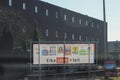 Sunlight illuminates banner with posters of political parties for election of the municipality of Zuidplas