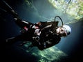 Sunlight illuminates a diver beneath the duckweed at Catfish Hotel in Manatee Springs State Park, Florida