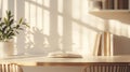 Sunlight Illuminates an Open Book on a Desk with Plants and Books Royalty Free Stock Photo