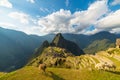 Sunlight on Machu Picchu, Peru, with llamas in foreground Royalty Free Stock Photo