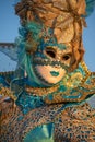 The sunlight on a magnificent mask at Carnival in Venice