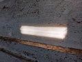 Sunlight penetrates through the cracks in the walls