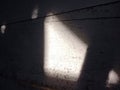 Sunlight penetrates through the cracks in the walls