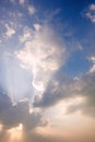 Sunlight rays and clouds on the sky