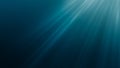 Sunlight rays shining through ocean surface. View from underwater. 3D rendered seamless loop animation