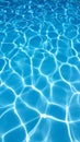 Sunlight reflecting on a clear blue water surface creating a caustic light pattern background Royalty Free Stock Photo