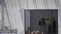 Sunlight and shadow on surface of concrete wall with construction material and equipment in door frame inside of house