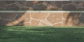 Sunlight and shadow on surface of doorsteps tile floor with blurred green artificial turf in front yard at home