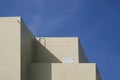 Sunlight and Shadow on yellow wall of Modern office Building against blue sky Royalty Free Stock Photo