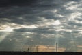 Sunlight shines through the cloudy sky. stormy sky with sunbeam. overcast weather Royalty Free Stock Photo