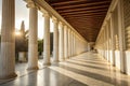 Sunlight shines through columns in long white corridor Royalty Free Stock Photo