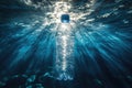 Sunlight shines through plastic bottle in ocean highlighting pollution Royalty Free Stock Photo