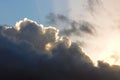 Sunlight shines through storm clouds with silver lining Royalty Free Stock Photo