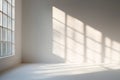 Sunlight shines through window in room, creating shadows on the wall and floor. space is bright and empty, showing modern, minimal Royalty Free Stock Photo