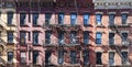 Sunlight shining on block of old buildings in the Upper East Side neighborhood in New York City