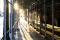 Sunlight shining through construction scaffolding above an empty sidewalk in Manhattan, New York City