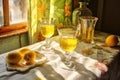 sunlight shining through limoncello-filled glasses on a table