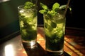 sunlight shining through mojito glasses casting shadows