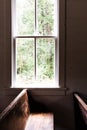 Sunlight spilling through window onto the pew of an old church Royalty Free Stock Photo