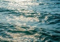 Sunlight sparkles on a gently rippling, deep blue ocean surface, Royalty Free Stock Photo