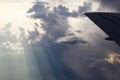 Sunlight Streaking Through Clouds Outside Airplane Window Royalty Free Stock Photo