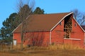 Red Barn with hay loft door missing Royalty Free Stock Photo