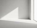 Sunlight streaming through a corner window Royalty Free Stock Photo