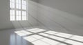 Sunlight streaming through a large window into a clean minimalist room casting dramatic shadows Royalty Free Stock Photo