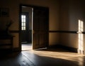 Sunlight Streaming Through a Slightly Opened Door in a Tranquil Room Royalty Free Stock Photo