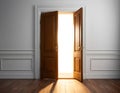 Sunlight Streaming Through a Slightly Opened Door in a Tranquil Room Royalty Free Stock Photo