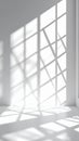 Sunlight Streaming Through Window Casting Geometric Shadows on White Wall and Floor Royalty Free Stock Photo