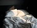 Morning Light on an Unmade Bed Royalty Free Stock Photo