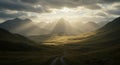 Sunlight streams through clouds, illuminating a serene valley surrounded by