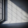 Sunlight streams through a large window with grid-like panes, casting geometric shadows on a Royalty Free Stock Photo