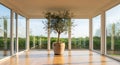 Elegant modern living space with a large indoor olive tree and panoramic windows Royalty Free Stock Photo