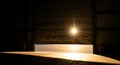 Sunlight streams through the opening of a partially open warehouse door at ground level Royalty Free Stock Photo