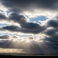 Sky features a mix of dark and light cloud formations allowing glimpses Royalty Free Stock Photo