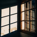 The window\'s warm wooden tones contrast with the cool, soft light illuminating Royalty Free Stock Photo