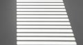 Sunlight Stripes Pattern on Gray Wall Through Blinds Royalty Free Stock Photo