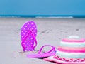 Sunlight Summer composition. Beach flip flops on tropical ocean sand. against blue sea and sky background. Beach Royalty Free Stock Photo