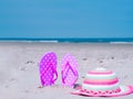 Sunlight Summer composition. Beach flip flops on tropical ocean sand. against blue sea and sky background. Beach Accessories Royalty Free Stock Photo