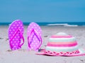 Sunlight Summer composition. Beach flip flops on tropical ocean sand. against blue sea and sky background. Beach Accessories Royalty Free Stock Photo