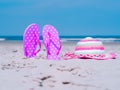 Sunlight Summer composition. Beach flip flops on tropical ocean sand. against blue sea and sky background. Beach Royalty Free Stock Photo