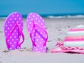 Sunlight Summer composition. Beach flip flops on tropical ocean sand. against blue sea and sky background. Beach Accessories Royalty Free Stock Photo