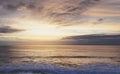 Sunlight sunset on horizon ocean on background seascape atmosphere rays sunrise. Relax view waves sea on evening sand beach, sun Royalty Free Stock Photo