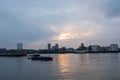 sunlight throw the clouds light reflecting onto the lake. Canary wharf UK