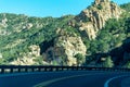 Sunlight tree hills and mountains in cliffs of arizona on road in hills for transportation with in shade with gaurd rail