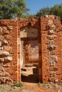 SUNLIGHT ON WALLS OF BRICK AND STONE WORK WORK OF INNER STRUCTURE OF A FORT IN RUIN
