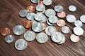 Sunlit American Coins on a Dark Wooden Table Background Royalty Free Stock Photo