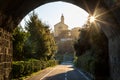 Sunlit arch over a bicycle path